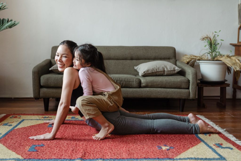 mother daughter doing yoga